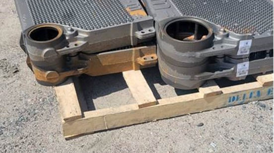 Industrial radiators strapped to a pallet for transport